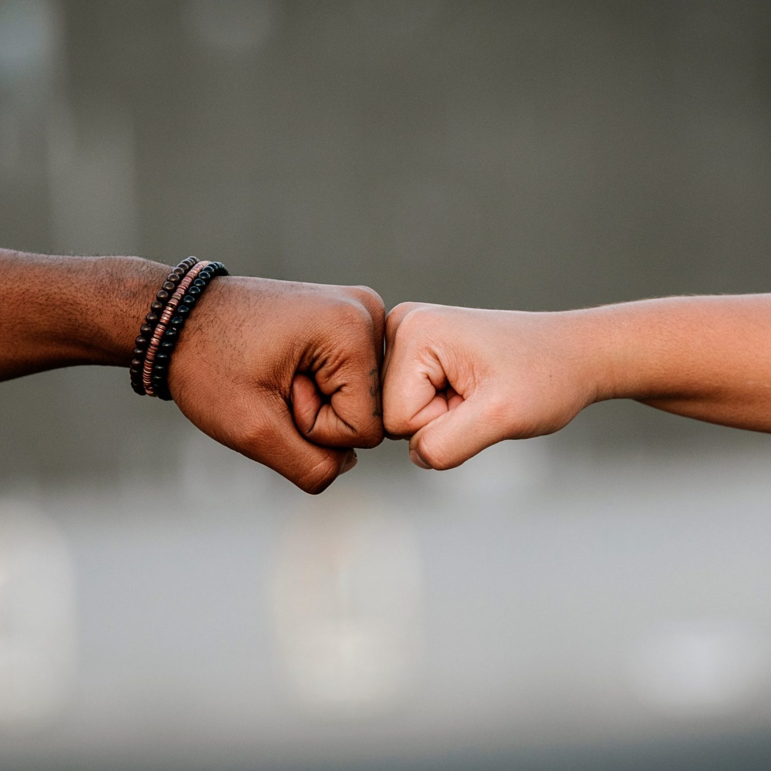 Close up of hands of different race. Racism Concept.